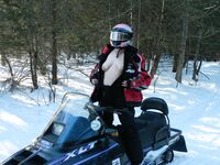 Tits out on the snowmobile