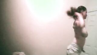 College girl changing top in bedroom