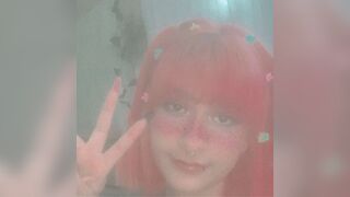 Pink hair slut Jackie shows her tits