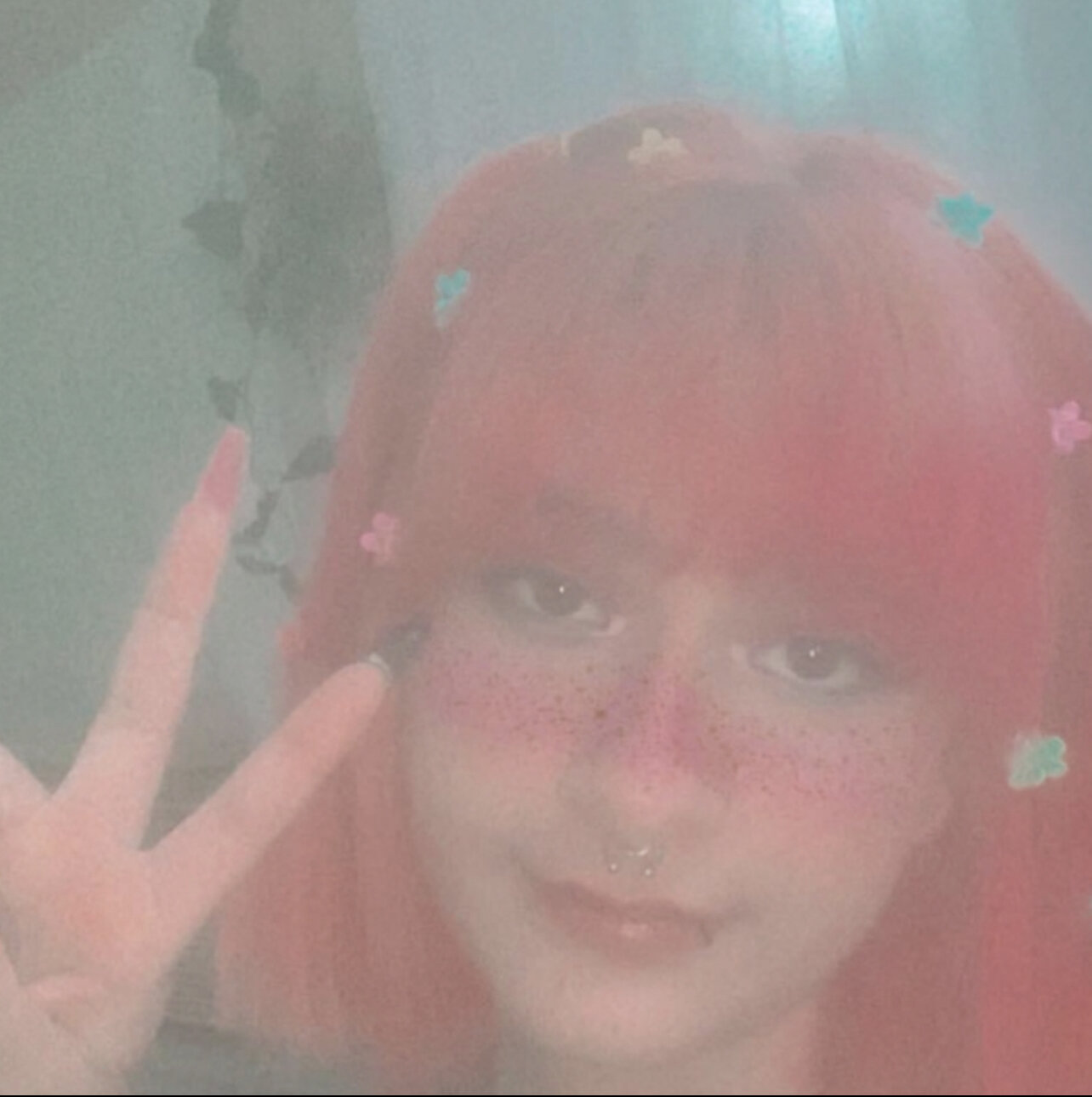 Pink hair slut Jackie shows her tits