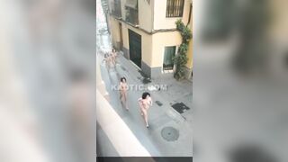 100s of naked women running & walking down the street