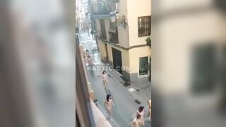 100s of naked women running & walking down the street