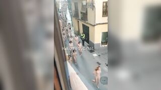 100s of naked women running & walking down the street