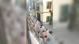 100s of naked women running & walking down the street